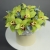 Композиция в шляпной коробке из 11 лаймовых орхидей в Щелково